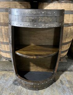 two wooden barrels stacked on top of each other