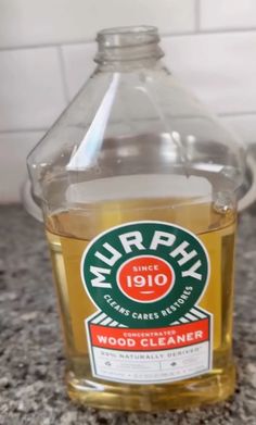 a bottle of wood cleaner sitting on top of a counter