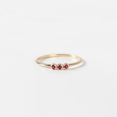 A stacking ring for women with a ruby in 14K solid yellow gold. A dainty minimalist 3 stone ring for women with natural gemstones and a great Christmas gift or a birthday gift as ruby is the July birthstone. 100% handcrafted with love! * Material: 14K solid gold, 14K white gold * Gemstones: Ruby, round cut * Gemstones' Weight: 0.06 ct HOW TO ORDER * Choose from the drop-down menus the available options (Ring size, Material) and leave us a note for any special requirements. PRODUCTION TIME - SHIPPING POLICIES * Please keep in mind that each item is handcrafted, and we need 5 days at least for its production. If you need your order on a specific date, please contact us. * All orders are shipped worldwide via FedEx Express for speed and security. The estimated delivery time is 3 days to the U Red Stone Ring, Gem Diamonds, 3 Stone Rings, Unique Wedding Bands, Fedex Express, Ring Minimalist, White Gold Engagement, July Birthstone, White Gold Engagement Rings