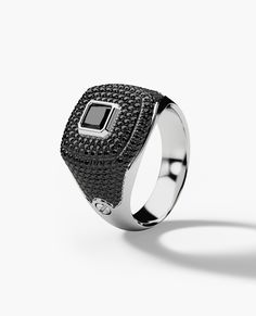 We will send you a size verification email once the purchase is completed. The BETZ iced out gold signet ring is a modern heirloom, featuring a showstopping princess cut black diamond surrounded by pave set brilliant cut black diamonds, with a total carat weight of 1.80. As with every Rockford piece, this black diamond signet ring is designed with individuality and custom izablility in mind. The BETZ signet ring, available in 16 variations, will quickly become your favorite pinky ring or stateme Formal Black Rings With Black Diamonds, Classic Black Ring With Halo Setting, Classic Black Diamond Ring With Brilliant Cut, Black Diamond Ring With Halo Setting For Formal Events, Black Diamond Ring With Halo Setting For Formal Occasions, Formal Black Diamond Ring With Halo Setting, Modern White Gold Rings With Black Enamel, Classic Black Diamond Ring With Black Enamel, Black Diamond Ring With Brilliant Cut For Formal Occasions