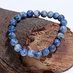 Blue Sodalite Smooth Round Gemstone Beaded Bracelet Stone : Sodalite Size : 7 - 8 mm Length : 7 Inches, 8 Inches ( Choose In Variation ) Shape : Round Finished : Smooth Color: Blue Birthstone: November Sodalite Round Beads Bracelets As Gifts, Sodalite Bead Bracelets As Gift, Adjustable Sodalite Beaded Bracelets With Round Beads, Sodalite Round Beads Bracelets For Healing, Adjustable Sodalite Beaded Bracelets With 8mm Beads, Adjustable Sodalite Gemstone Beaded Bracelets, Blue Spiritual Wristband With 8mm Beads, Hand-strung Blue Sodalite Bracelet, Blue Sodalite Hand-strung Bracelet