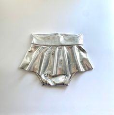 "Shiny Silver Skirted Bummies Runs true to size, available in sizes 0/3 months to 24months/2T Waist (stretchy) 0/3: 15\" 3/6: 16\" 6/12: 17\" 12/18: 18\" 18/24 months: 18.5\" 2T: 19\" Hand Wash with Cold Water & Hang dry for best results." Fitted Shorts For Playtime, Bottoms With Elastic Waistband For Playtime, Playful Fitted Bottoms For Playtime, Playful Fitted Playtime Bottoms, Summer Playtime Elastic Bottoms, Unisex Bottoms With Elastic Waistband For Playwear, Playful Fitted Party Bottoms, Elastic Short Bottoms For Playwear, Fitted Bottoms For Playwear In Summer