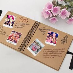 an open spiral notebook with pictures and words on it next to some pink orchids