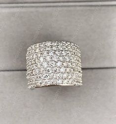 a diamond ring sitting on top of a box