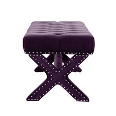 the foot stool is made from purple fabric and has studded trims on it