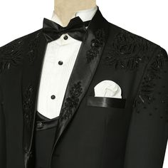 This luxurious black designer tuxedo suit is perfect for any special occasion from weddings and galas to red carpet events. Made with premium Italian wool and hand-embroidered with intricate details, this suit will make you look and feel your best.The tuxedo jacket features a black satin lapel with handwork, single button closure, a pocket square, double flapped pockets, and an inner round lining. It comes with a double-breasted waistcoat with a satin lapel. Pair it with a white tuxedo shirt, bl Elegant Black Suit For Gala, Bespoke Black Tuxedo For Party, Luxury Black Suits For Gala Events, Luxury Tailored Suits For Gala, Designer Black Suits For Wedding, Luxury Tailored Suit For Gala Events, Custom Fit Black Tuxedo For Party, Luxury Gala Suits For Formal Occasions, Designer Black Tuxedo For Groom