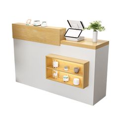 a white counter with shelves and plants on it