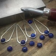 Today I’m setting lapis lazuli cabochons in sterling silver teardrop earrings. The next step will be polishing and making the ear wires. Blue Cabochon Drop Jewelry, Nickel Free Teardrop Pendant Earrings, Blue Drop Jewelry With Cabochon, Blue Drop Cabochon Jewelry, Modern Teardrop Pendant Jewelry With Ear Wire, Minimalist Nickel-free Teardrop Pendant Earrings, Sapphire Drop Beads For Jewelry Making, Metal Teardrop Earrings With Lever Back Ear Wires, Teardrop Metal Jewelry With Lever Back Ear Wires