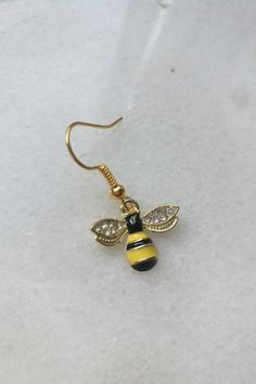 Aesthetic gold honey bee drop earrings. Cute, unique, elegant. Tiny bee with little crystals. Adorable connection. #beeearrings #honeybeeearrings #bumblebeeearrings #cutebeejewelry #goldhoneybee #beedangleearrings Handmade Honey Color Jewelry Gift, Handmade Honey Jewelry For Gift, Handmade Honey-colored Jewelry For Gifts, Nickel-free Hexagon Earrings For Gift, Nickel-free Hexagon Earrings As A Gift, Handmade Hexagon Jewelry, Nickel Free Gold Hexagon Jewelry, Jewelry With Crystals, Crazy Earrings