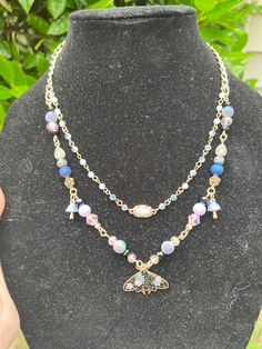 I handcrafted a beautiful double strand moth necklace. It is made with some upcycled materials. It is adjustable and ready to ship. Necklaces Beads, Keychain Designs, Moth Necklace, Bead Ideas, Upcycled Materials, Keychain Design, Knoxville Tn, Double Ring, Natural Materials