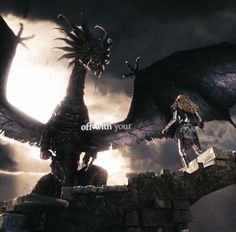 a woman standing on top of a bridge next to a giant dragon with its wings spread