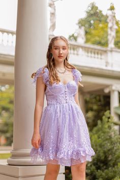 The dreamiest floral embroidered dress, coming in a gorgeous lavender lace and lined with satin. The delicate corseted bodice adorned with satin-covered buttons makes this dress perfect for a garden party or any special occasion. Wear the ruffled sleeves off your shoulders to add the perfect amount of dreaminess to your look. Fabric: Floral embroidered lace beaded with pearls Sweetheart neckline Elasticated ruffled sleeves Corseted bodice with boning Satin covered buttons Built in padded bra cup Bra Cup, Floral Embroidered Dress, Fabric Floral, Padded Bra, Ruffled Sleeves, Scalloped Hem, Bra Cups, Beaded Lace, Embroidered Lace