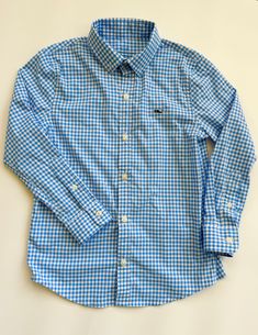 Light blue and white gingham plaid button down long sleeve shirt by Vineyard Vines. The Performance material; 91% nylon, 9% spandex. Size 6 $20 By Vineyard Vines Gingham Long Sleeve Shirt For Work, Long Sleeve Gingham Shirt For Work, Gingham Long Sleeve Tops For Spring, Classic Plaid Shirt For Spring, Preppy Long Sleeve Shirt For Spring, Preppy Fitted Shirt For Fall, Long Sleeve Gingham Tops For Spring, Fitted Plaid Shirt For Spring, Preppy Long Sleeve Shirt For Summer