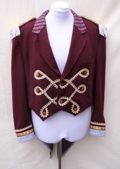 "Mens Extra large  , Upcycled red ringmaster , greatest showman tailcoat . Would fit a women size UK 24  ,US 20 Made from a mens ' Next  ' red woollen jacket. It also has gold Braid and gold buttons.  Measures chest 129 cm ( 50.5 \") Waist 124 cm (49 \") shoulder to hem front 57 cm full length back 107 cm sleeve length 65.5 cm top sleeve width 22.5 cm shoulder seam 16.5 cm across front 48 cm (across back 51 cm ) all the way around armhole 64 cm  Can post quickly if needed by a certain date. Need Black Ringmaster Jacket, Circus Jacket, Zatanna Cosplay, Steampunk Festival, Gothic Jackets, Circus Theme, Circus Party, Dress Out, Funky Art