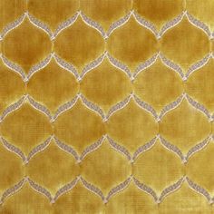 an image of a yellow and silver fabric with diamond shapes on it's surface