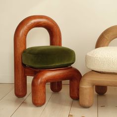 a wooden chair and ottoman sitting next to each other