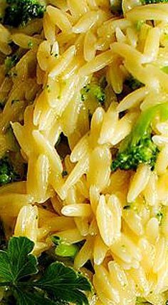 pasta with broccoli and parsley in a white bowl