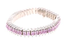 Pink Sapphire & Diamond Bracelet This Bracelet has 52 Natural Emerald Cut Pink Sapphires that weigh 12.00 Carats. It also has 104 Round Cut Diamonds that weigh 2.60 Carats. The total carat weight of the bracelet is 14.60 Carats. (Clarity: VS, Color: F) It is made in 14 Karat White Gold and weighs approximately 49.1 grams. The Bracelet is 7 inches long. Big Bracelets, Modern Bracelets, Multi Sapphire, Bracelets Gold Diamond, White Gold Bracelet, Tennis Bracelet Diamond, Princess Cut Diamonds, Natural Emerald, Pink Diamond