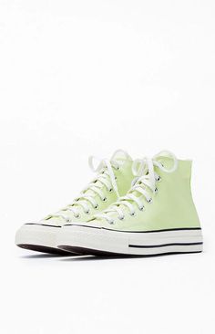 Step into timeless style with Converse's Lime Chuck Taylor All Star 70 High Top Sneakers. These iconic kicks blend vintage aesthetics with modern comfort, featuring premium materials and the classic Chuck Taylor design that effortlessly elevates your casual look..PLEASE NOTE: This shoe is offered in men's sizes; the conversion for Converse shoes is a size and a half smaller for women. For example, a woman who is a size 7 should order a size 5.5 in men's..Canvas upper.Lace-up front closure.High-top silhouette.Contrast stitching.Metal eyelets.Converse branding.Chuck Taylor All Star ankle patch Retro High-top Sneakers For Spring Streetwear, Retro Green Sneakers With Speckled Midsole, Retro Sneakers With Speckled Midsole For Spring, Retro Converse High-top Sneakers, Vintage Green High-top Sneakers With Rubber Sole, Green Vintage High-top Sneakers With Rubber Sole, Vintage Sneakers With Gum Sole For Spring, Retro High-top Spring Sneakers, Retro High-top Sneakers For Spring