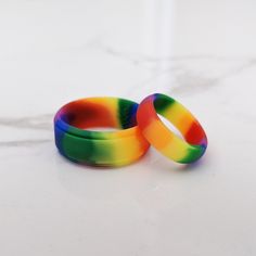 How are Knot Theory Rainbow rings different? Vibrant and non-fading rainbow to brighten up your getup. Twice more rainbow than other rainbow rings, twice more fun! More comfortable than not wearing pants. Durable. Quality construction, high performance. Pinch-free. Callus-free. We take care of your fit so you can fully experience your Knot Theory rings. Silicone Ring Women, Rubber Rings Wedding, Silicone Wedding Band, Silicone Wedding Rings, Rave Accessories, Double Rainbow, Rainbow Rings, Silicone Ring, Rubber Rings