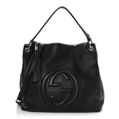 This is an authentic GUCCI Pebbled Calfskin Large Soho Hobo in Black. This stylish shoulder bag is crafted of soft pebbled calfskin leather in black. The bag features a leather top handle, an optional adjustable leather shoulder strap with brass links, a tassel zipper pull, and a stitched interlocking G logo on the front. The top zipper opens to a natural fabric interior with zipper and patch pockets. Gucci Soft Leather Shoulder Bag, Designer Gucci Bag In Soft Leather, Designer Gucci Soft Leather Bag, Gucci Luxury Soft Leather Shoulder Bag, Luxury Gucci Shoulder Bag In Soft Leather, Luxury Gucci Soft Leather Shoulder Bag, Designer Gucci Shoulder Bag In Soft Leather, Designer Gucci Soft Leather Shoulder Bag, Luxury Gucci Soft Leather Bag