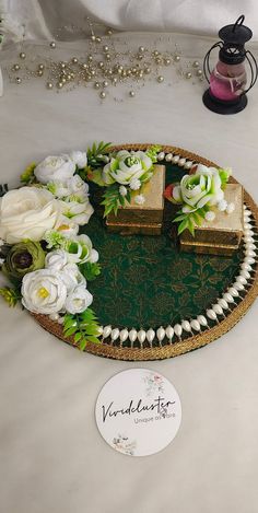 there is a decorative tray with flowers on it