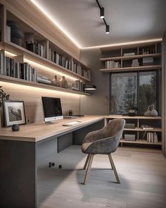 a modern home office with built in bookshelves