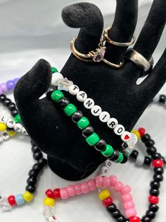 A cute bracelet with a one size fits most featuring the popular character from Kimetsu no Yaiba (Demon Slayer) Tanjiro. Take him on your travels wherever you may go. You never know when you need a Hashira. 🔥 Black Harajuku Style Jewelry Gift, Fandom Style Black Jewelry Gift, Black Fandom Jewelry Gift, Adjustable Fandom Bracelets As Gift, Black Fandom Inspired Jewelry Gift, Novelty Black Friendship Bracelets, Adjustable Beaded Bracelets For Fandom Gifts, Customized Black Themed Jewelry, Customized Themed Black Jewelry