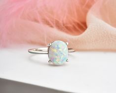 * Stunning handmade solid gold opal ring. This ring is designed to look elegant from all sides of your finger. You will not be able to take your eyes off the fascinating color of opal stone and the magnificent glitter of solid gold. 14K and 18K options are avaliable. It is suitable for daily use * ★Item Details ♥Made to Order ♥Gold Kt: 14K & 18K ♥Available Gold Color: Gold, Rose Gold, White Gold ♥Opal Stone Size: 09 x 07 mm Oval ♥Ready to Ship in 1 - 3 Business Days ✔ Shipped to the Worldwid Oval Opal Ring With Polished Finish, Fine Jewelry Oval Opal Ring With Polished Finish, Oval Opal Ring With Polished Finish In Fine Jewelry, Oval Opal Rings With Polished Finish, Oval Opal Promise Ring, Minimalist Oval Cabochon Opal Ring For Anniversary, Opal Oval Cabochon Ring With Polished Finish, Polished Opal Oval Cabochon Ring, Polished Opal Ring In Oval Cabochon Shape