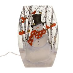 a snowman is standing in front of some trees with birds on his head and wearing a red scarf