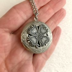 "Please note: If you need more than one, multiple quantities are available upon checkout. Timeless and classic, this gorgeous antiqued silver or gold clover locket will become a special addition to your jewelry collection. The locket is 32mm in diameter, silver or gold plated brass and opens for a secret place to keep pictures, messages, or whatever you like. The locket has an antique silver stainless steel rolo chain or antique gold solid brass chain with a lobster clasp. You may choose 18', 20 Clover Locket, Headpiece Accessories, Silver Locket Necklace, Style Birthday, Travel Vintage, Picture Locket, Secret Place, Gold Locket, Vintage Pendant