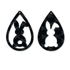 two black and white silhouettes of rabbits in tear shaped earrings