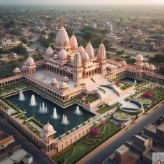 an aerial view of a palace with fountains