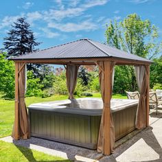 a gazebo with a hot tub in the middle