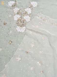 Explore Khinkhwab's exquisite collection featuring the timeless allure of Lucknowi Chikankari work. Originating from the Mughal era, this ancient embroidery style is among Lucknow's most revered art forms. Each piece, meticulously handcrafted, showcases intricate floral motifs in delicate white thread on fine muslin, embodying timeless elegance and cultural heritage. Elegant Unstitched Suit With Dupatta For Festivals, Elegant Unstitched Suit With Intricate Embroidery For Festivals, Elegant Unstitched Suit With Zari Work For Festivals, Elegant Unstitched Chinon Suit For Festivals, Elegant Chinon Unstitched Suit For Festivals, Eid Raw Silk Unstitched Suit With Mirror Work, Festive Chinon Kurta With Intricate Embroidery, Unstitched Zari Work Suit For Wedding, Elegant Unstitched Festive Suit For Festivals