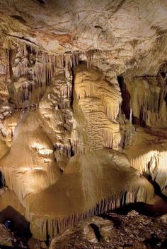 the inside of a cave with stalate formations