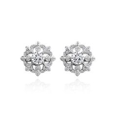 These stunning earrings showcase 5mm cubic zirconia center stones set in a dazzling CZ snowflake design, a must-have item for any holiday and evening celebration. The earrings secure by post with friction-backs and are made of .925 sterling silver. These earrings are the perfect addition to any jewelry collection and can be purchased as stud earrings for women and stud earrings for teen girls. Product Details Metal Type sterling-silver Metal Stamp 925-sterling Weight 3.5GR Length 13.5MM Width 13 Round Diamond Earrings With Sparkling Stones, Sterling Silver Diamond Earrings With Sparkling Stones, Fine Jewelry Earrings With Sparkling Round Stones, Dazzling Round Cut Earrings With Sparkling Stones, Dazzling Round Sterling Silver Cluster Earrings, Cubic Zirconia Round Cut Diamond Earrings, Silver Diamond Earrings With Round Accents, Diamond White Diamond Earrings With Sparkling Stones, Dazzling Diamond Earrings With Round Cut Sparkling Stones