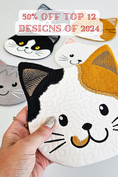 a hand holding a cat shaped cushion with the text 50 % off top 12 designs of 2012