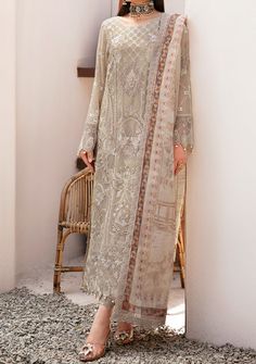 Introducing our Chiffon collection DASTAN by Ramsha designed to make you look and feel your best These pieces will add a touch of class and elegance to your wardrobe. This collection is a beautiful collection of ensembles offering versatile compositions for the latest festive wardrobe requirements. Embroidered Chiffon Front With Sequence. Embroidered Chiffon Back and Sleeves. Embroidered Organza Lace. Embroidered Organza Ghera, and Trouser Lace. Embroidered Net Dupatta. Raw Silk Trouser. Color: There might be slight color variation due to lighting and flashes while the photo shooting. The color may also vary because of different screen resolutions. Wash Care: Dry Clean Only. Silk Wedding Dress Pakistani, Chiffon Lawn Suit With Sheer Dupatta And Long Sleeves, Long Sleeve Chiffon Lawn Suit With Sheer Dupatta, Eid Lawn Suit With Sheer Dupatta In Chiffon, Eid Lawn Suit With Resham Embroidery In Chiffon, Eid Chiffon Lawn Suit With Resham Embroidery, Festive Chiffon Kurta With Zari Work, Designer Chiffon Lawn Suit With Intricate Embroidery, Elegant Beige Georgette Salwar Kameez