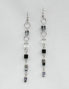 Dangle Earrings, Ring and Block Chain with Black and Clear Block Beads in Silver or Gold Tone, Conte Modern Wire Wrapped Jewelry For Party, Minimalist Jewelry With Dangling Round Beads, Modern Jewelry With Dangling Beads As A Gift, Adjustable Silver Beaded Earrings With Beaded Chain, Black Beaded Chain Earrings As A Gift, Silver Beaded Chain Earrings As Gift, Black Beaded Dangle Jewelry, Sterling Silver Jewelry With Beaded Chain And Dangle Shape, Black Metal Jewelry With Dangling Beads