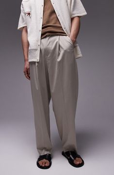 Crisp creases and a pleat front elevate wide-leg pants made with a peck of stretch for comfort. Zip fly with hook-and-bar closure Front slant pockets 69% polyester, 29% viscose, 2% elastane Machine wash, line dry Imported Relaxed Fit Wide-leg Dress Pants With Welt Pockets, Relaxed Fit Wide Leg Dress Pants With Welt Pockets, Formal Wide Leg Pants With Pockets And Relaxed Fit, Wide Leg Relaxed Fit Dress Pants With Welt Pockets, Wide-leg Bottoms With Pressed Crease For Spring, Spring Wide-leg Bottoms With Pressed Crease, Spring Bottoms With Pressed Crease And Wide Leg, Classic Wide Leg Straight Pants, Wide Leg Work Pants With Welt Pockets For Summer