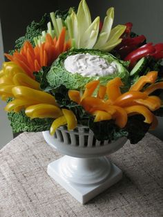 an arrangement of vegetables in a white bowl