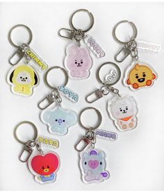 a bunch of key chains with different designs on them