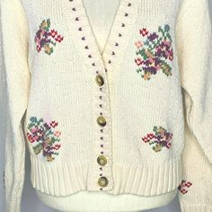 "Vintage LizSport Knit Cardigan Sweater M Cream Floral Embroidery Buttons V Neck Brand: LizSport Made in Korea Size M 100% Cotton Measurements: Chest: 20\" underarm to underarm Sleeve length: 22\" Length: 21\" from shoulder to hem Pre-owned Some color bleeding on some of the flowers and along the v-neck." Casual Cream Cardigan With Floral Embroidery, Knit Fair Isle Pattern Cardigan For Spring, Spring Knit Cardigan With Fair Isle Pattern, Spring Fair Isle Knit Cardigan, Beige Embroidered Cotton Cardigan, Embroidered Knit V-neck Cardigan, Embroidered V-neck Knit Cardigan, Cream Embroidered Winter Cardigan, Winter Cream Embroidered Cardigan