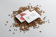 some seeds are scattered around a business card