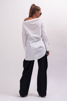 Easy and breezy, the Unstoppable Cotton womens white shirt features an asymmetrical construction, a wide avant garde collar, relaxed sleeves, and an asymmetrical button closure. With black pants, this white cotton long sleeve shirt makes Monday mornings bearable. The White asymmetrical shirt is designed to be comfortable and not troublesome to wear. After wearing this White long sleeve shirt women, you will love it even more. The white blouse for women is made of high quality fabric with cottone Womens White Shirt, White Shirt Long Sleeve, White Blouse Women, Long White Shirt, Long Sleeve Shirt Women, Asymmetrical Shirt, Cotton Shirts Women, Women White Blouse, White Shirts Women