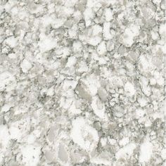 a close up view of a marble counter top with white and gray speckles