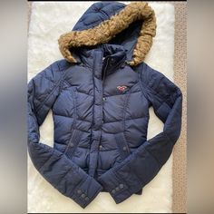 Hi, I’m Selling A Brand New Without Tag Hollister Hoodie Jacket Size Xs. Super Cute And Stylish. Perfect For The Winter And Rain! Casual Hooded Jacket With Padded Collar, Blue Puffer Jacket With Adjustable Hood For Fall, Casual Blue Puffer Jacket With Fleece Lining, Blue Fitted Hooded Jacket For Fall, Casual Fitted Hooded Jacket With Detachable Hood, Fitted Hooded Casual Outerwear, Casual Fitted Hooded Outerwear, Fitted Casual Hooded Puffer Jacket, Casual Fitted Hooded Puffer Jacket