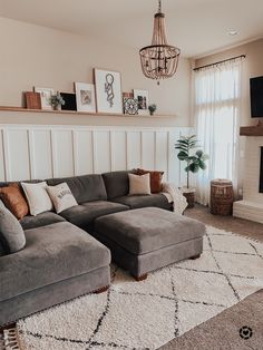 a living room filled with furniture and a fire place in the corner on top of a rug