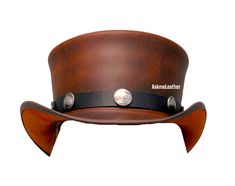 Leather Top Hat Bull Button Band Style Steampunk Top Hat Brown Top Hat Handmade with 100% Cowhide Leather Gift for him New with Tags Description: * High-Quality Craftsmanship handmade * Real Leather * 100% pure leather **Those living in remote areas will have to pay $45 extra as shipping charges before the item is shipped. Sizing: Heads come in all sizes, and in a lots variety of shapes. Although high quality hats are adaptable, and will usually conform to differences in shape with a little wearing, it is essential that the size be correct for the head. To determine your hat size, measure the circumference around your head, keeping the tape level and firm, across the temples and above the eyebrow ridges. Check the size chart given below. For in-between measurements use the next size up. Ha Steampunk Leather Brimmed Hat Bands, Steampunk Leather Hat Band With Short Brim, Brown Leather Steampunk Hat, Steampunk Brown Leather Hat, Brown Steampunk Brimmed Top Hat, Vintage Brown Top Hat With Flat Crown, Leather High Crown Top Hat For Festival, Steampunk Leather Top Hat With Flat Crown, Steampunk Leather Festival Hat